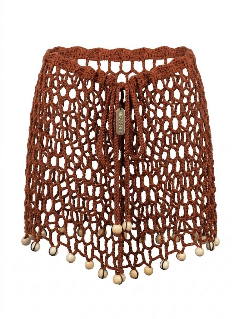 ARUMA, falda de crochet terracota abierto para usar sobre bikini.