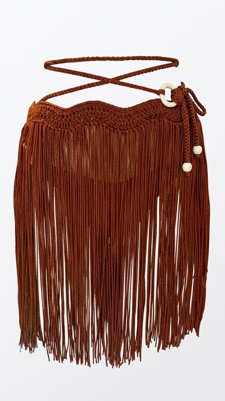 Falda mini tassel artesanal con ondas en pretina y bolas madera clara — MIZZBOGI Beachwear Colombia

Detalle de tejido artesanal con aro y bolas madera clara, falda tassel MIZZBOGI