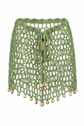 Minifalda ARUMA pistacho sin modelo, tejida en crochet calado con cuentas decorativas y cordones ajustables.