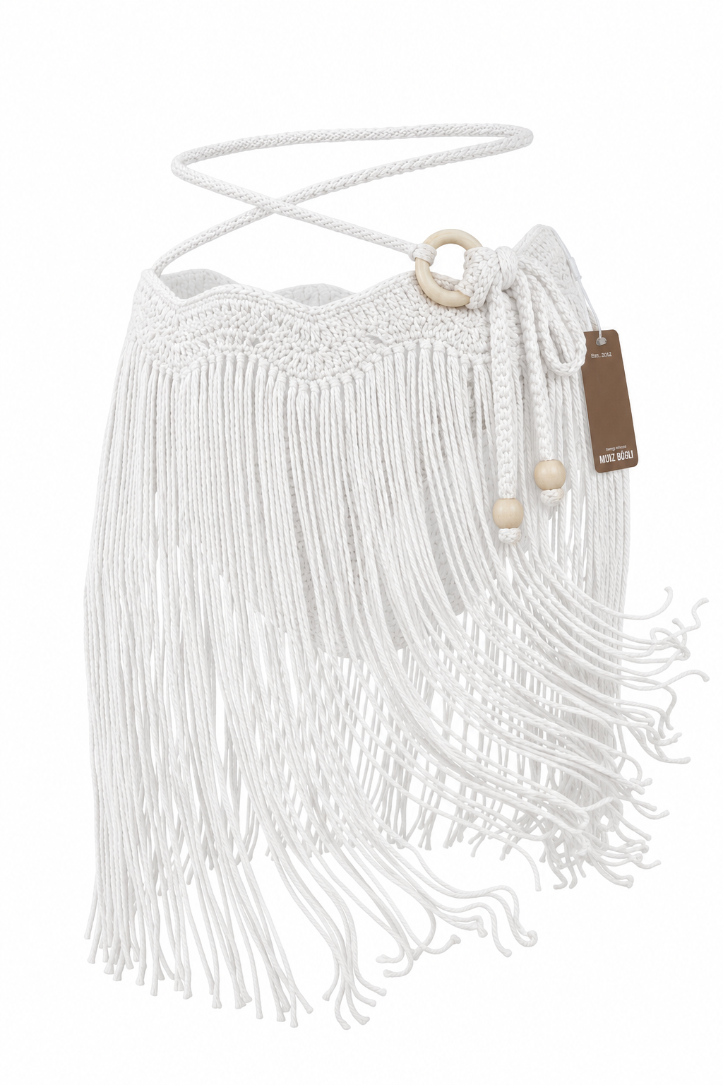Falda MINI TASSEL OLAS blanca sin modelo, con pretina de ondas tejida a mano, flecos largos, tiras ajustables y aro lateral en tono madera clara.
